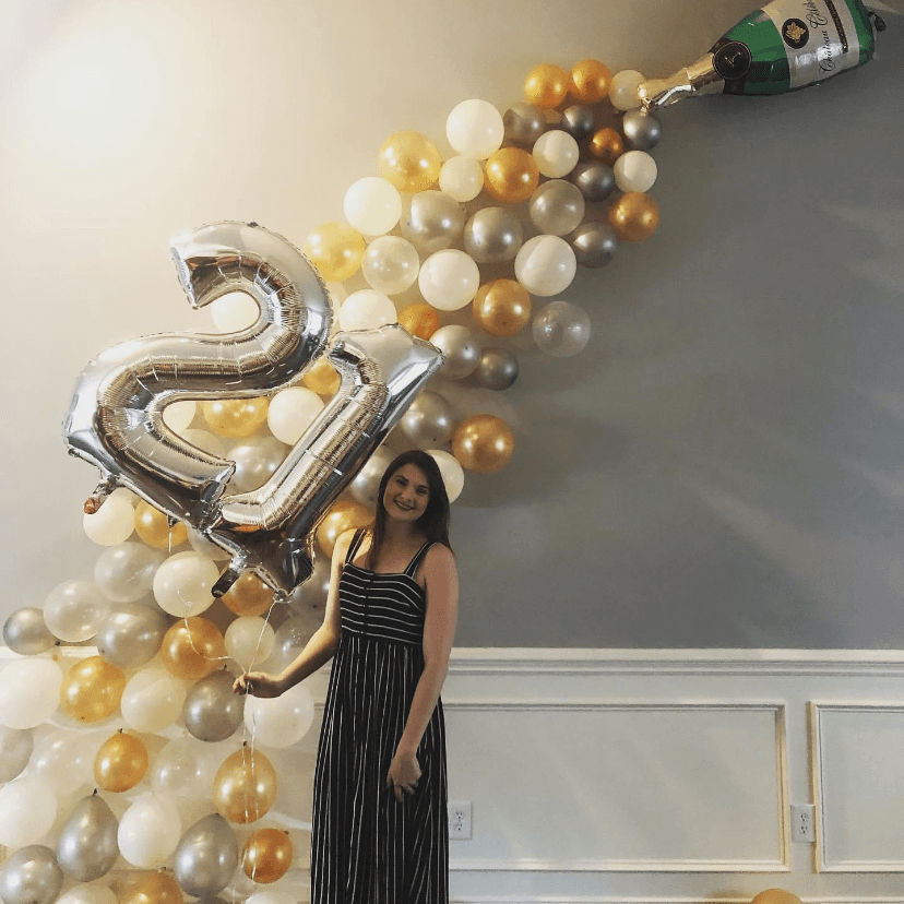 Gold and silver cascading balloon installation for a 21st birthday